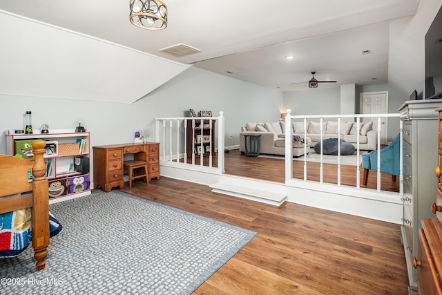 rec room featuring a ceiling fan, wood finished floors, visible vents, recessed lighting, and vaulted ceiling