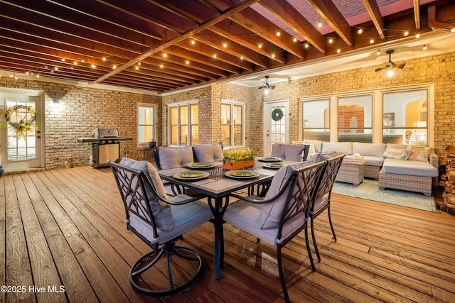 wooden deck with an outdoor living space, a grill, and outdoor dining area