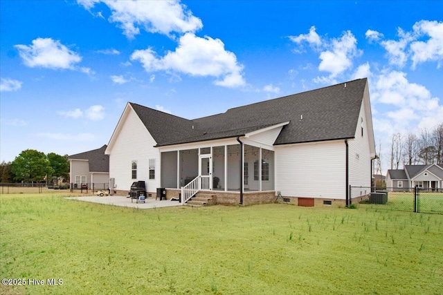 rear view of house with a patio, central AC, fence, a yard, and a sunroom