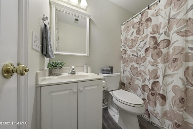 bathroom with vanity and toilet