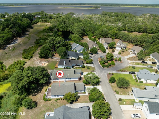 birds eye view of property featuring a residential view, a view of trees, and a water view