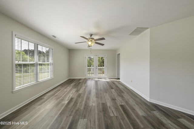 empty room with french doors, visible vents, a wealth of natural light, and ceiling fan