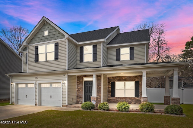 view of front facade featuring covered porch, a shingled roof, concrete driveway, a garage, and brick siding