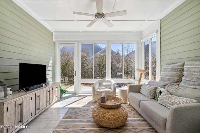 sunroom / solarium featuring a ceiling fan and coffered ceiling