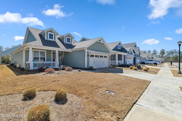 view of front of home with driveway, a porch, a shingled roof, a garage, and board and batten siding