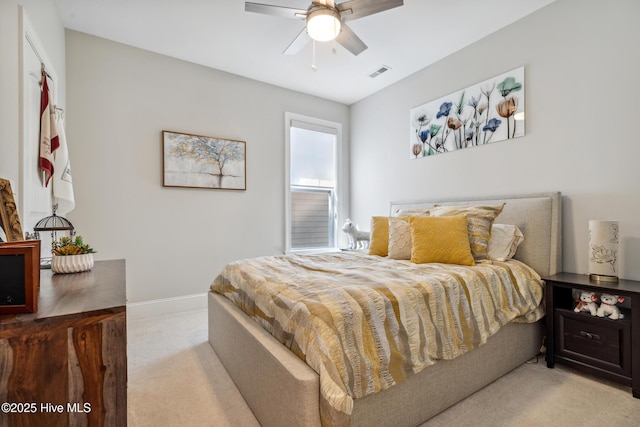 bedroom with a ceiling fan, baseboards, visible vents, and light carpet