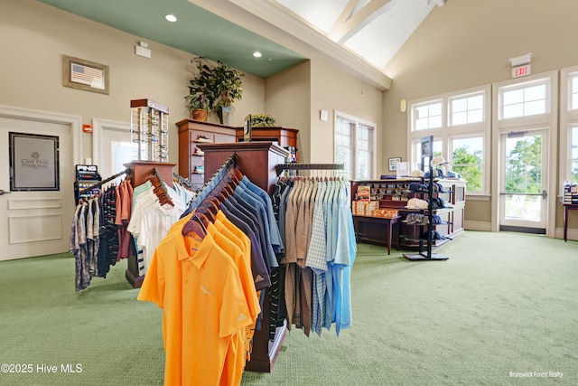 interior space featuring baseboards, carpet floors, high vaulted ceiling, recessed lighting, and beamed ceiling