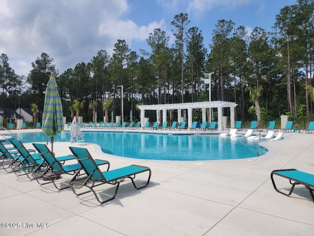 community pool featuring a patio, fence, and a pergola