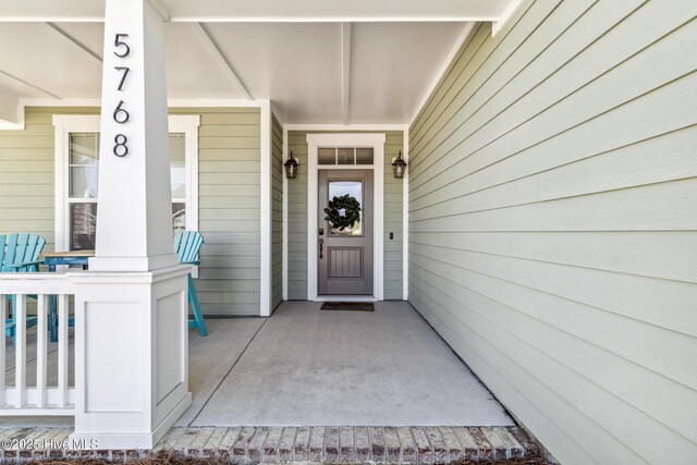 doorway to property featuring a porch