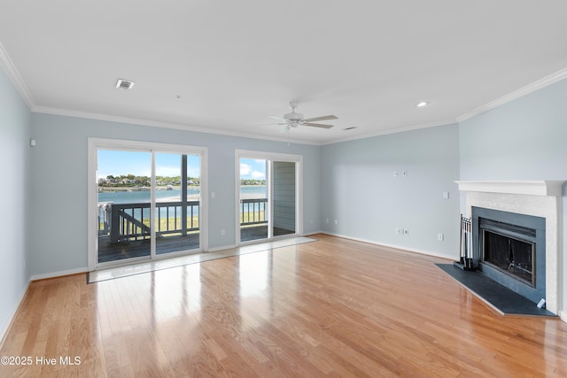 unfurnished living room featuring ceiling fan, visible vents, baseboards, and light wood-style floors
