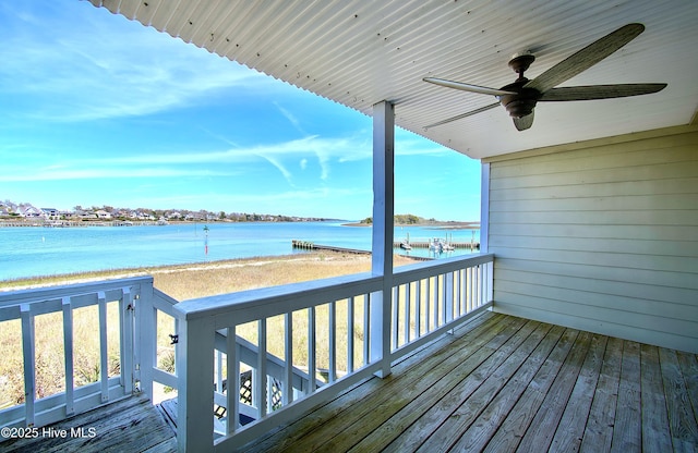 deck featuring a water view and ceiling fan