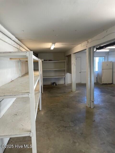 basement with freestanding refrigerator