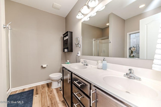 113 Sedgewood Ct, Aberdeen, NC 28315 - full bathroom with a shower stall, wood finished floors, a sink, and toilet