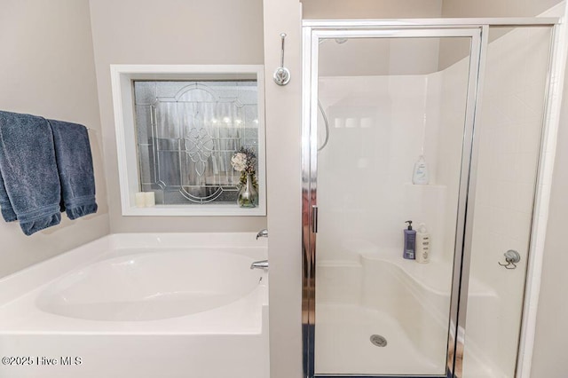 113 Sedgewood Ct, Aberdeen, NC 28315 - bathroom featuring a bath and a stall shower