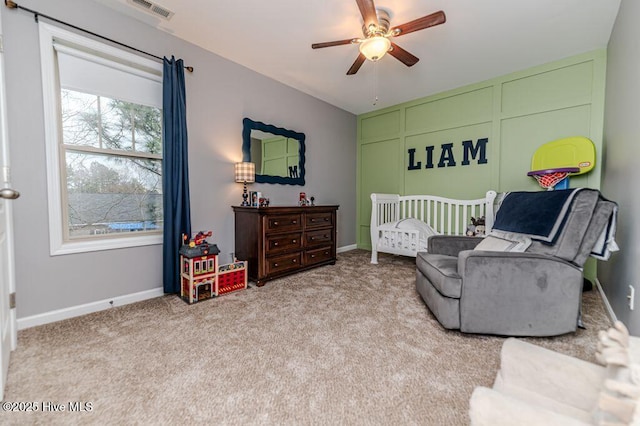 bedroom featuring visible vents, baseboards, and carpet