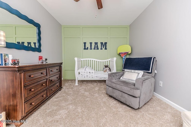 carpeted bedroom with a ceiling fan and baseboards