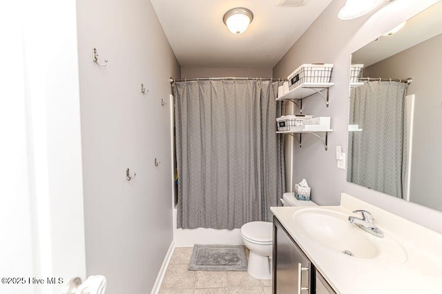 full bathroom featuring tile patterned flooring, baseboards, toilet, shower / bath combo with shower curtain, and vanity