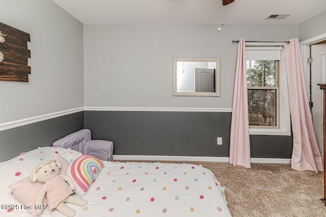 carpeted bedroom with baseboards and visible vents