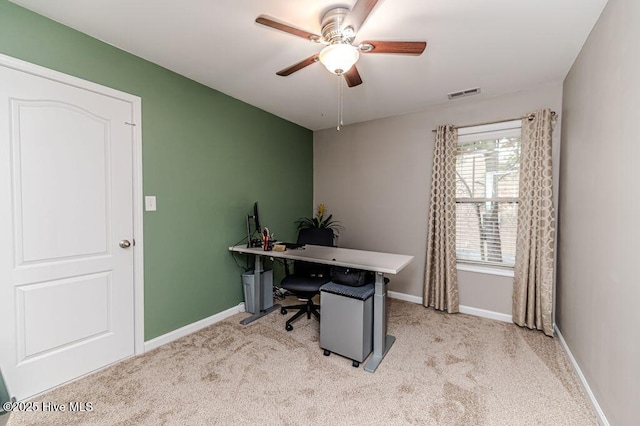 home office featuring visible vents, baseboards, ceiling fan, and carpet flooring