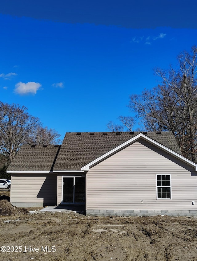 view of home's exterior featuring a shingled roof