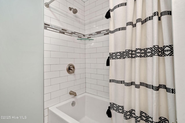 bathroom with shower / bath combination with curtain