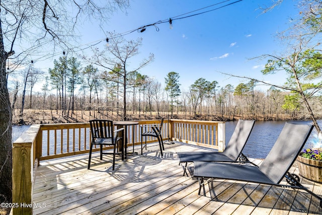 wooden deck featuring a water view