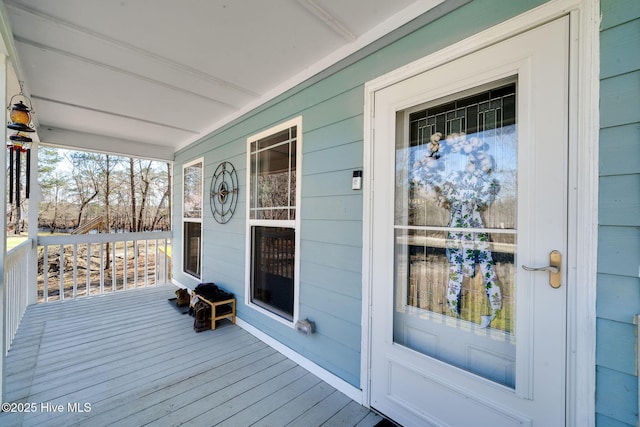 wooden deck featuring covered porch