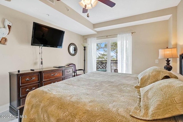 bedroom featuring access to outside and a ceiling fan