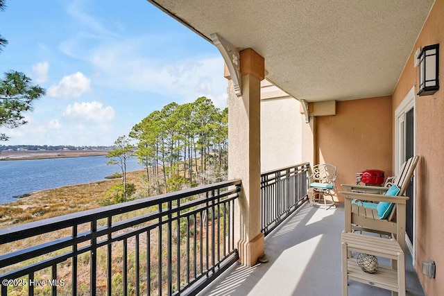 balcony featuring a water view