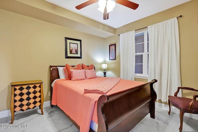 bedroom with baseboards, marble finish floor, and a ceiling fan