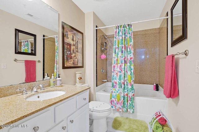 bathroom featuring visible vents, toilet, vanity, and shower / bath combination with curtain