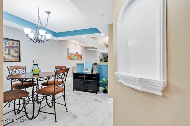 dining space featuring a chandelier, recessed lighting, marble finish floor, and baseboards