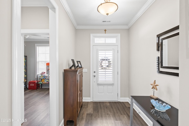 entryway featuring visible vents, a healthy amount of sunlight, and wood finished floors