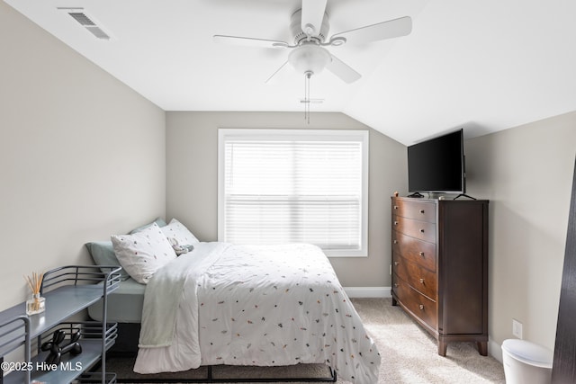 bedroom featuring visible vents, light carpet, baseboards, ceiling fan, and vaulted ceiling