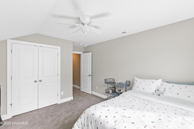 bedroom with carpet, visible vents, baseboards, ceiling fan, and a closet