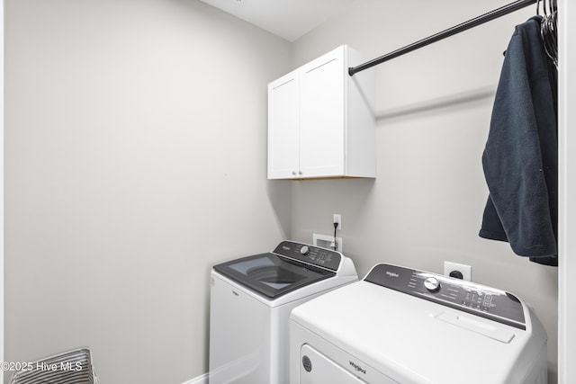 laundry room featuring cabinet space and independent washer and dryer