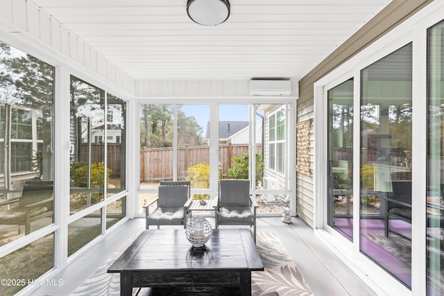 sunroom / solarium with a wall mounted air conditioner