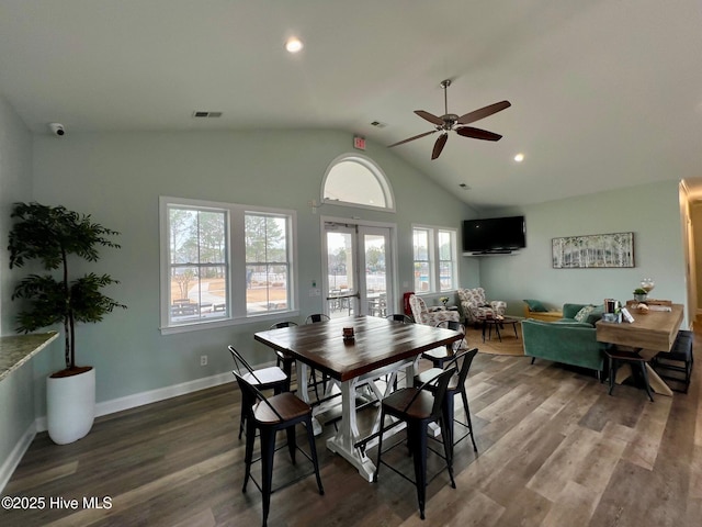 dining space featuring baseboards, wood finished floors, visible vents, and ceiling fan