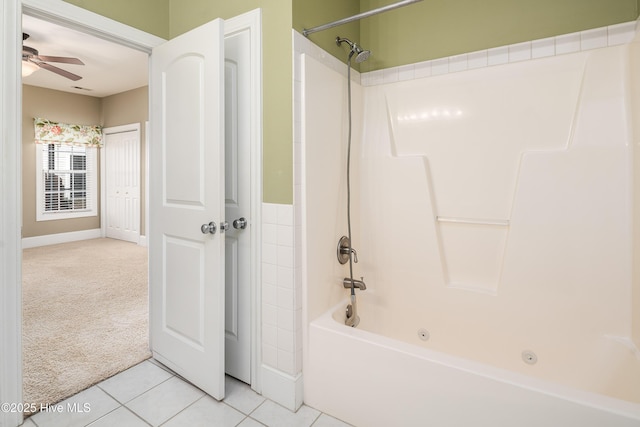 bathroom featuring tile patterned flooring, ceiling fan, and shower / washtub combination