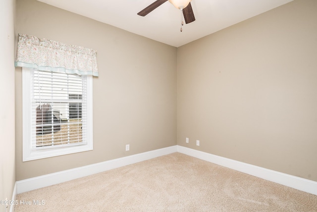 unfurnished room with baseboards, carpet, and ceiling fan