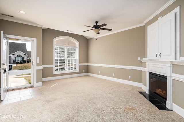 unfurnished living room with a ceiling fan, light colored carpet, and visible vents