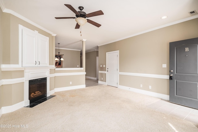 unfurnished living room with visible vents, light colored carpet, ceiling fan, and crown molding