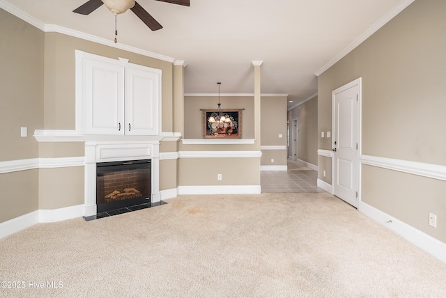 unfurnished living room featuring a fireplace with flush hearth, ceiling fan with notable chandelier, crown molding, and carpet floors