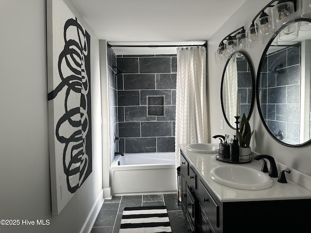 bathroom featuring a sink, baseboards, shower / bath combo, and double vanity