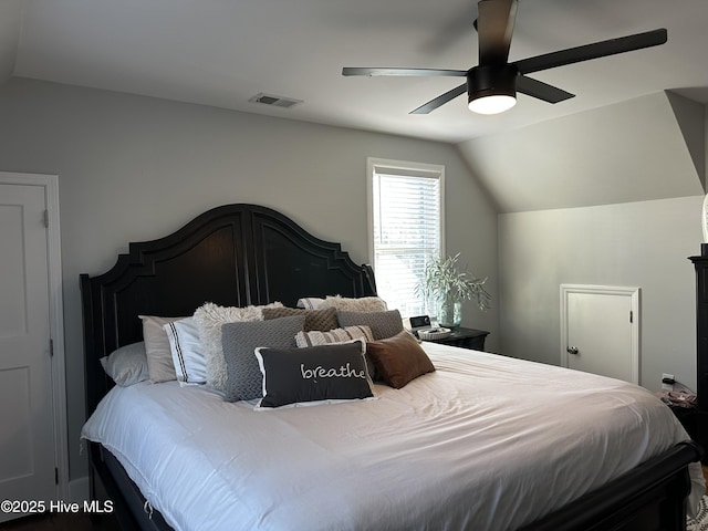 bedroom featuring visible vents, ceiling fan, and lofted ceiling