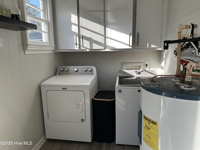 laundry room with cabinet space, independent washer and dryer, wood finished floors, and water heater