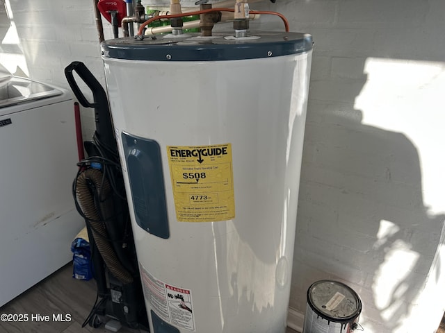 utility room featuring electric water heater