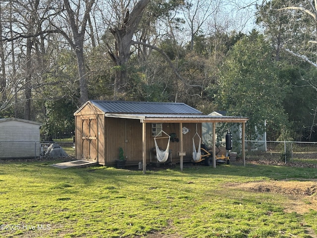 view of shed with fence