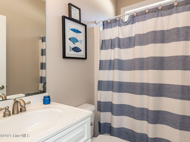 129 Sunset Dr, Cedar Point, NC 28584 - full bath featuring curtained shower, toilet, and vanity