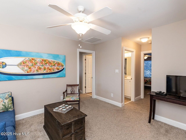 129 Sunset Dr, Cedar Point, NC 28584 - carpeted living room featuring visible vents, baseboards, and ceiling fan